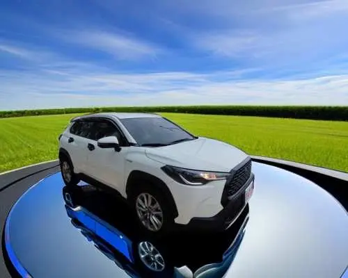 A pristine white comfortable SUV gleaming under a blue sky and green fields, symbolizing safe, reliable, and convenient door-to-door private airport transfer services for Hsinchu and Miaoli.
