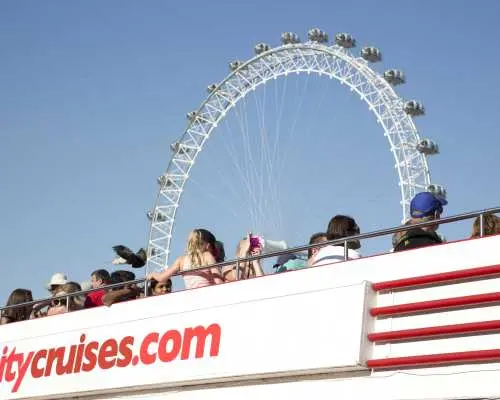 View of the London Eye from a River Thames cruise boat, offering a unique water-based perspective and an appreciation of the city's charm from the river.