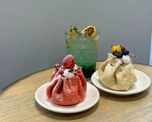 Delicious desserts at a Seoul fortune-telling cafe: two fruit crepes and a refreshing specialty drink, perfect for relaxing after a consultation.