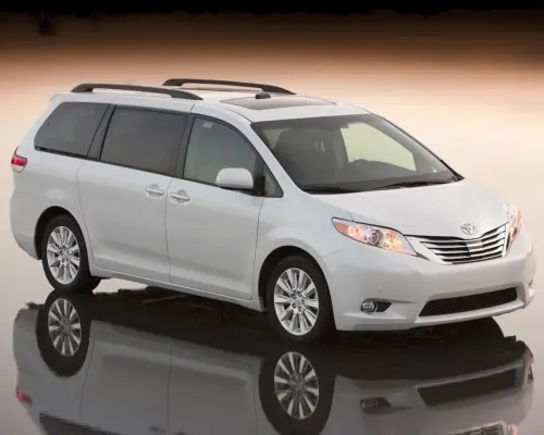 A sleek white minivan, showcasing a comfortable and private transfer option for Atlanta airport to downtown hotels, ensuring personal space and convenience.