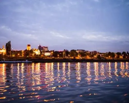 Sunset motorboat cruise on the Vistula river with prosecco