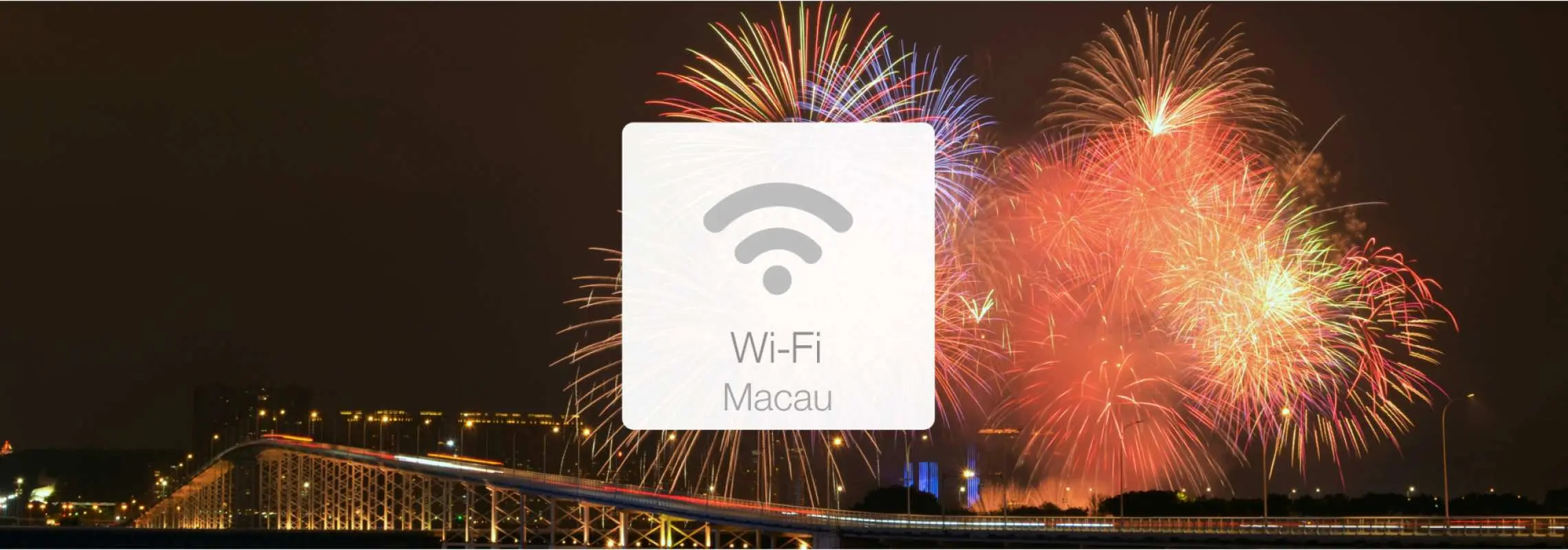 Macau night scene with dazzling fireworks over a bridge, featuring a central Wi-Fi icon. Represents Macau 4G portable Wi-Fi rental, offering travelers unlimited data connectivity.