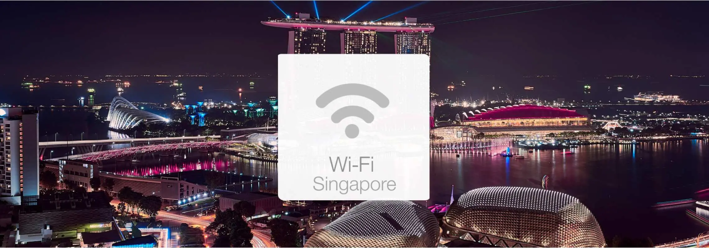 Singapore city night view featuring Marina Bay Sands and the skyline, overlaid with a Wi-Fi symbol and "Wi-Fi Singapore" text, highlighting the convenience of renting 4G portable Wi-Fi with unlimited data for seamless connectivity during travel.
