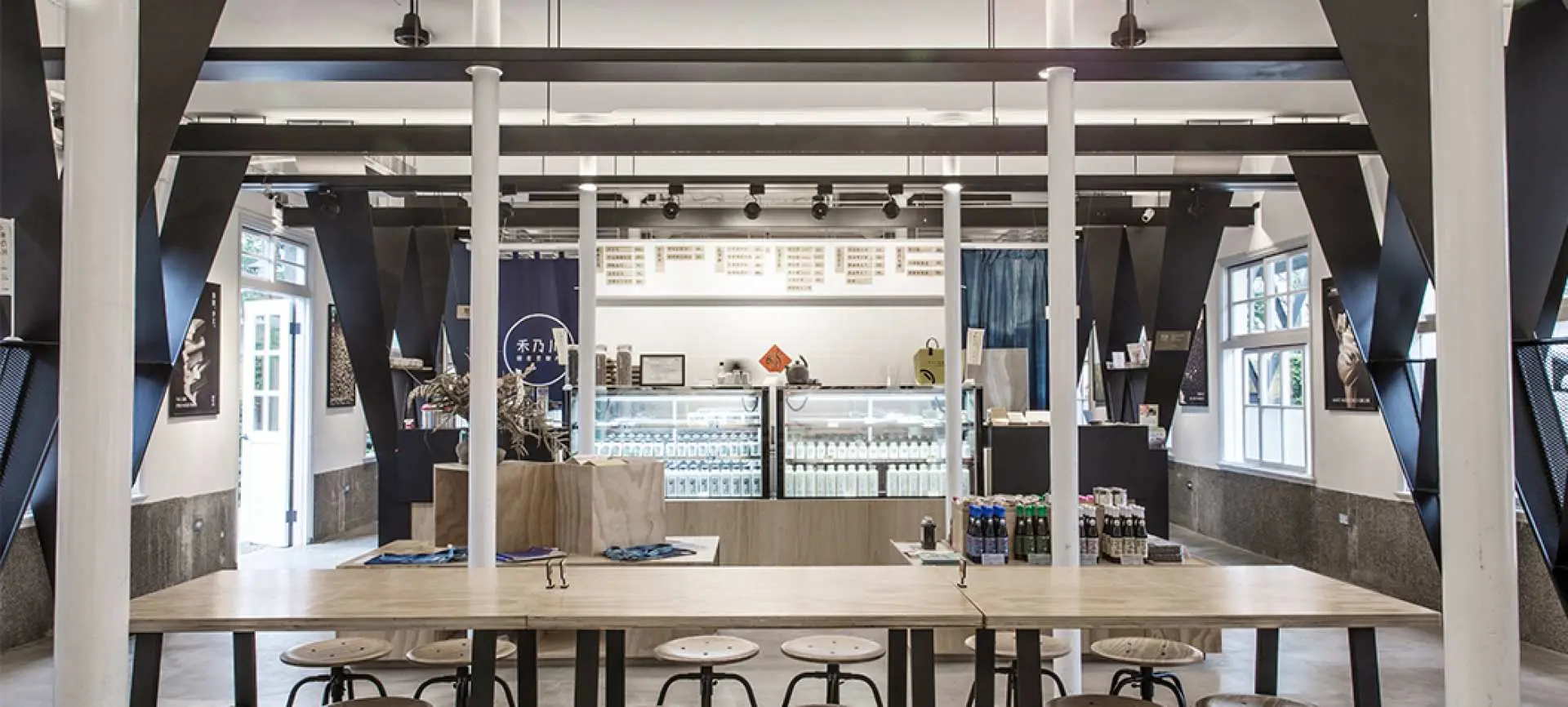 Inside Hernai Chuan Soy Product Shop, a modern and clean space showcasing various fresh soy products, offering unique culinary delights and local souvenirs in Taipei/New Taipei.