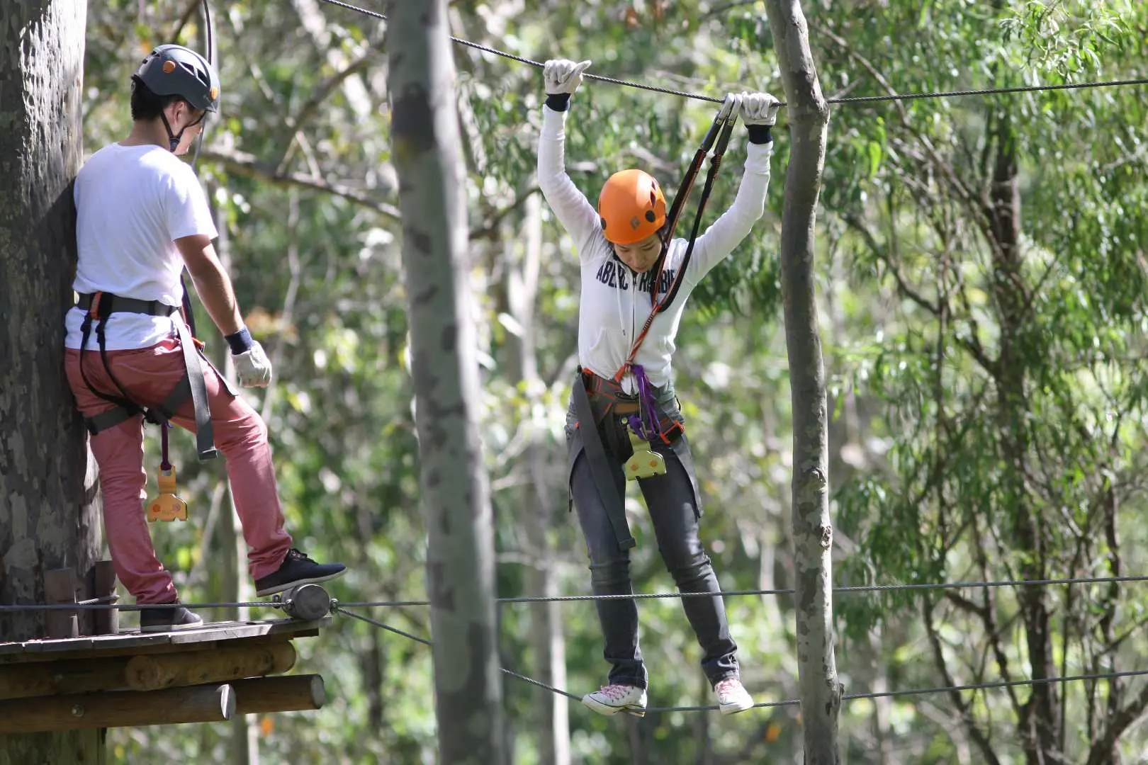 guest with helmet walking along wires
