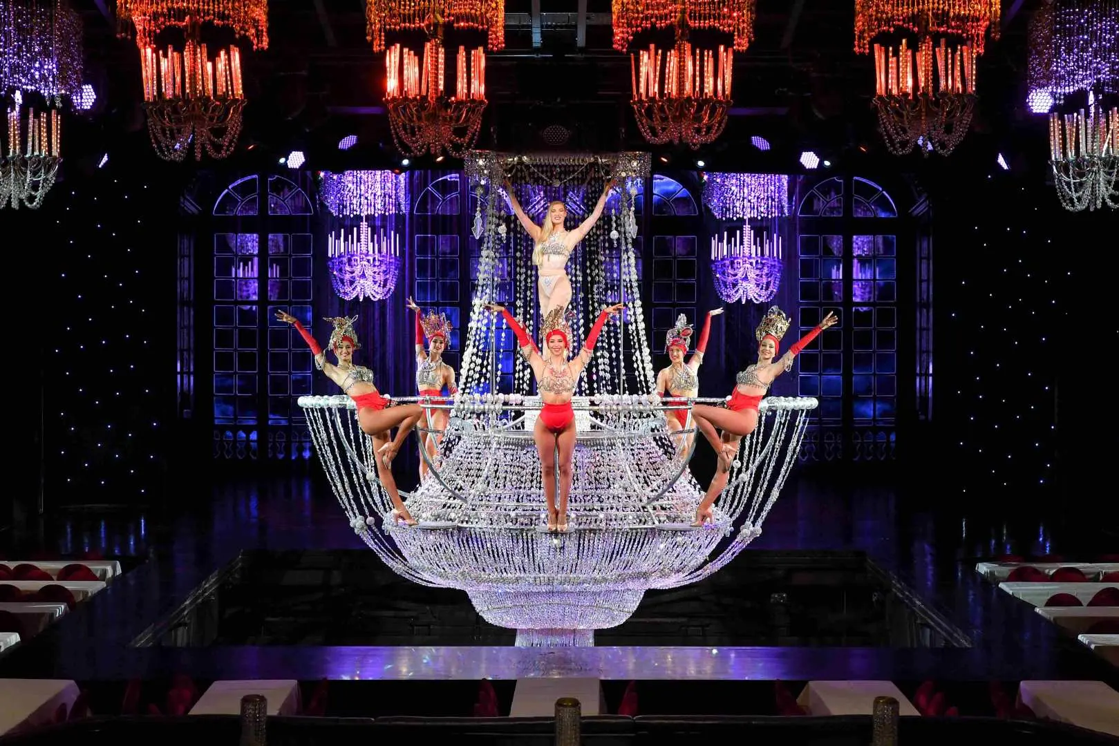 dancers performing on a chandelier
