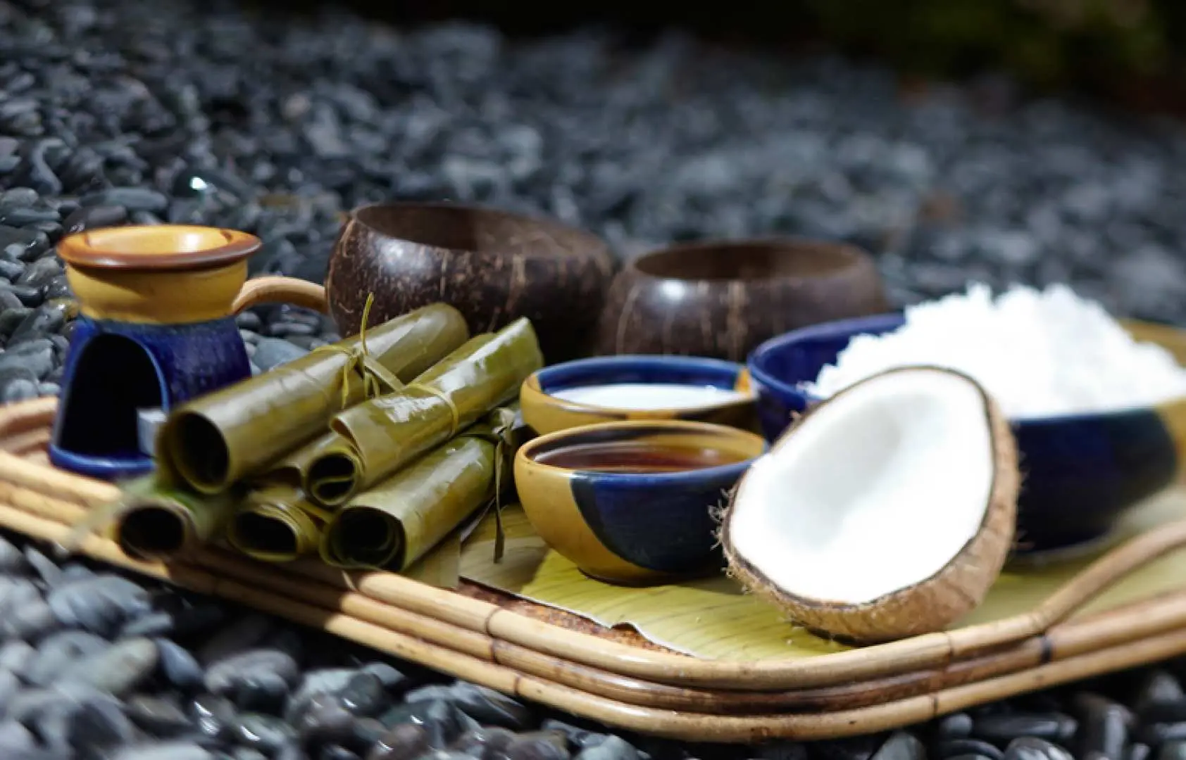 At Amuma Spa in Cebu, a tray showcases natural spa amenities and special dining options, including fresh coconut and local delicacies.