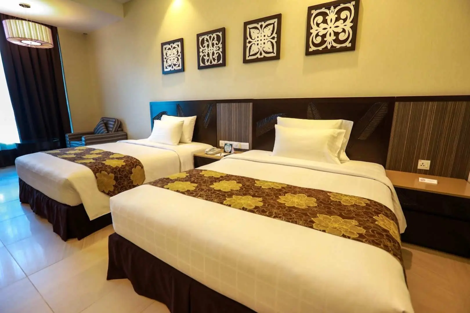 The Premier Family Room of Bangi Resort Hotel in Selangor has direct access to the pool, these spacious modern rooms are best for families and those who prefer staying close to the hotel amenities