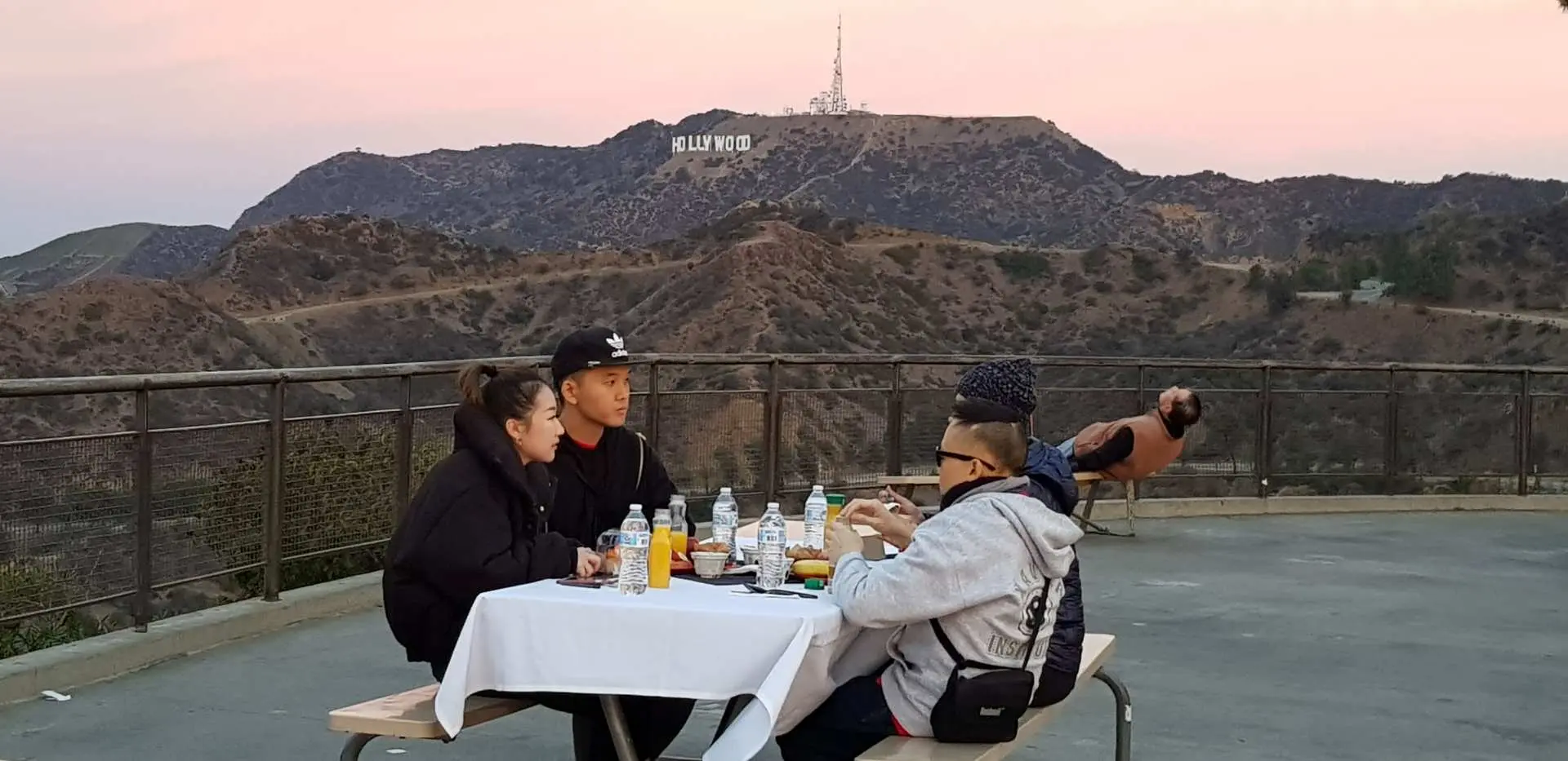 Enjoy a continental breakfast as the sun slowly rises over the Hollywood sign on the Scoot Car Sunrise Tour