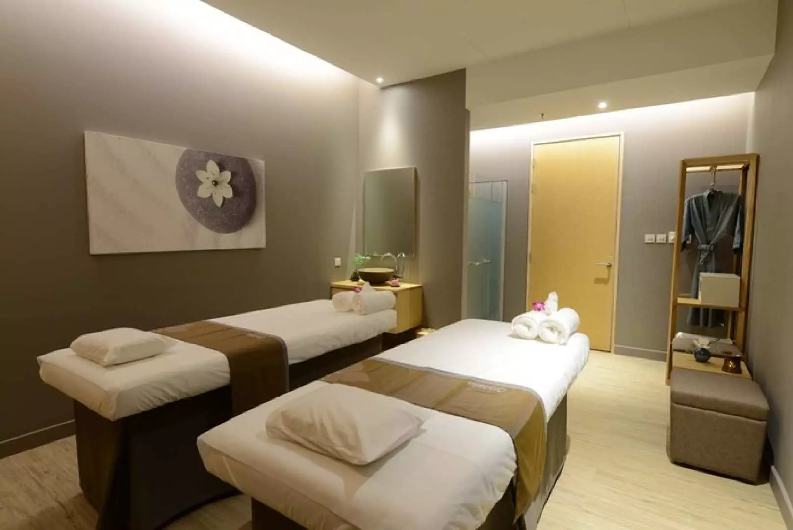 Serene and modern couple's massage room at Let's Relax Spa in Trang, Thailand, featuring two clean massage beds, perfect for a private spa treatment experience.