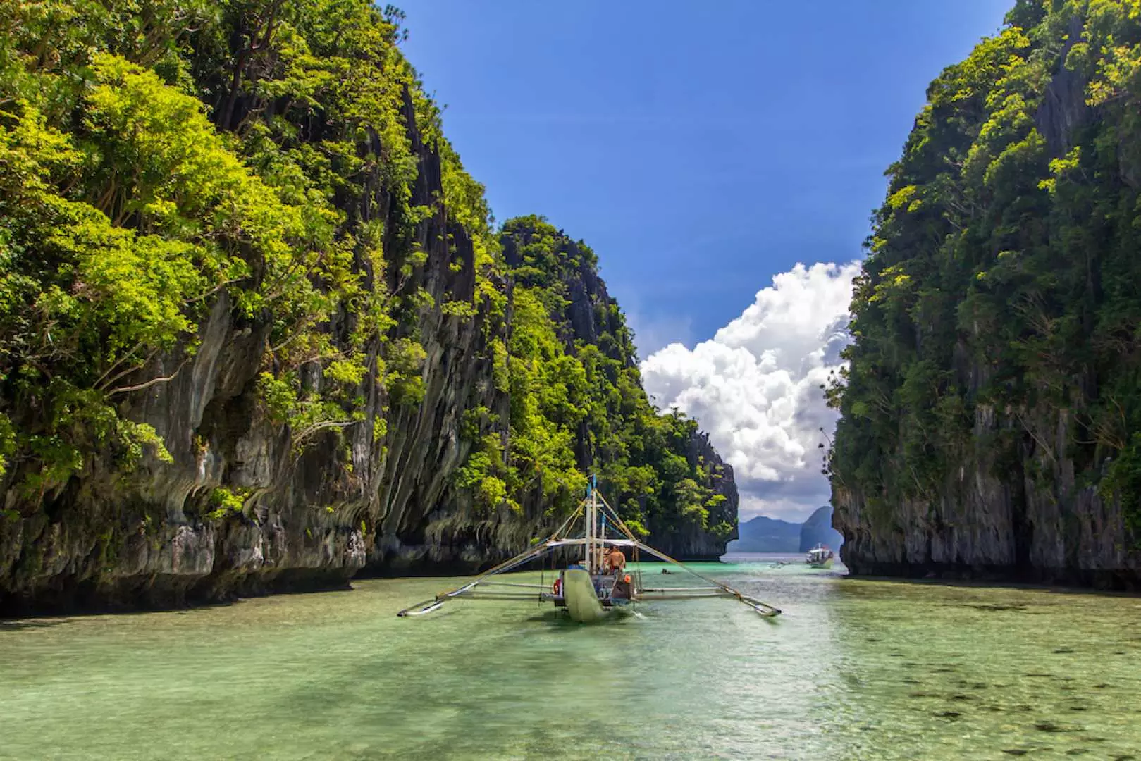 Kayak between the lowering limestone mountains at Big Lagoon in this 2-in-1 El Nido Bundle Tour