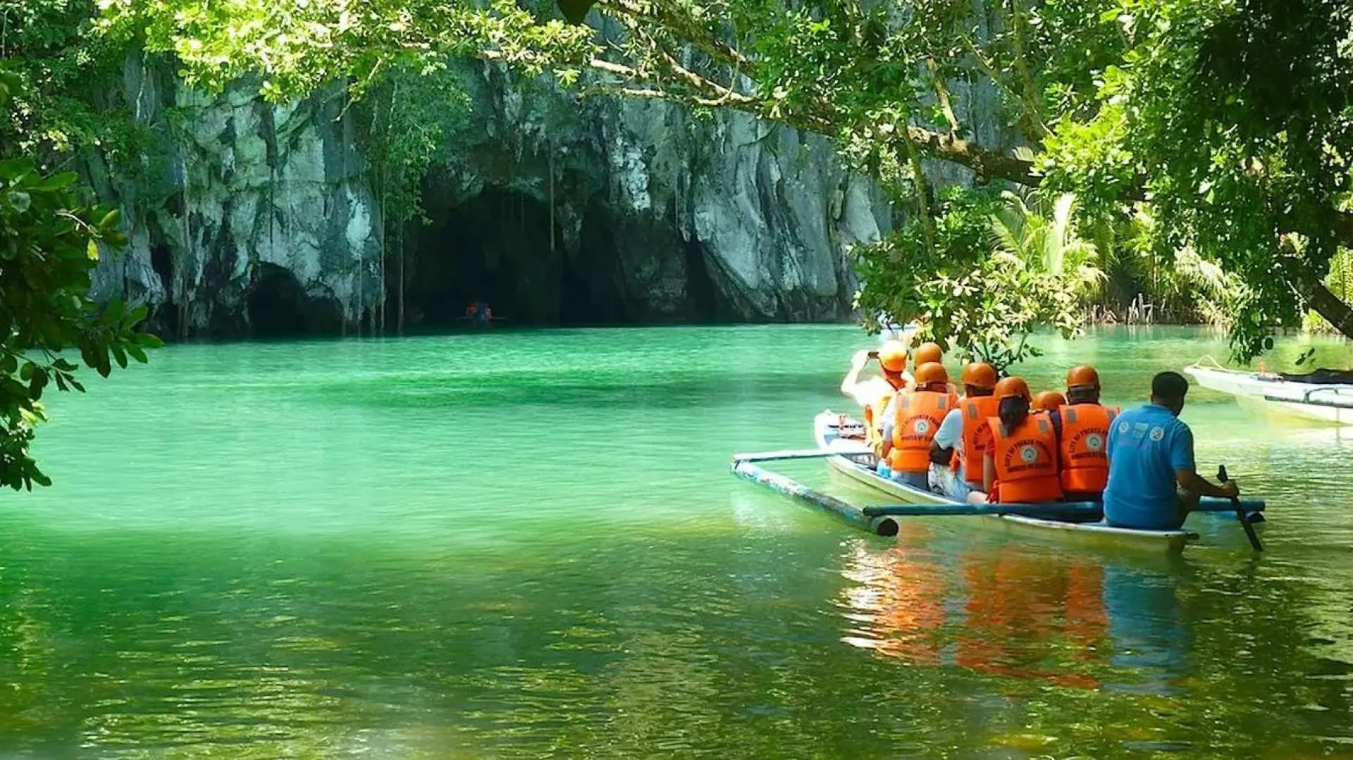 Enter the cave by a paddle boat