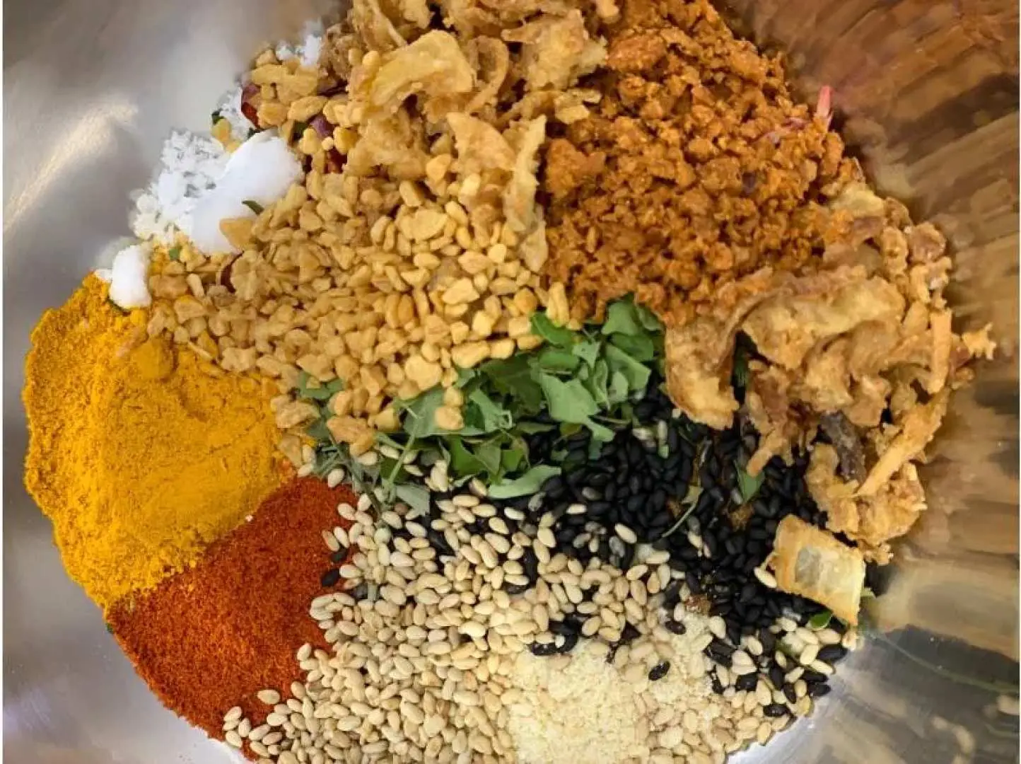 Close-up of Ishigaki Island chili oil making ingredients, featuring around 30 local spices and dried components for personalized flavor blending.