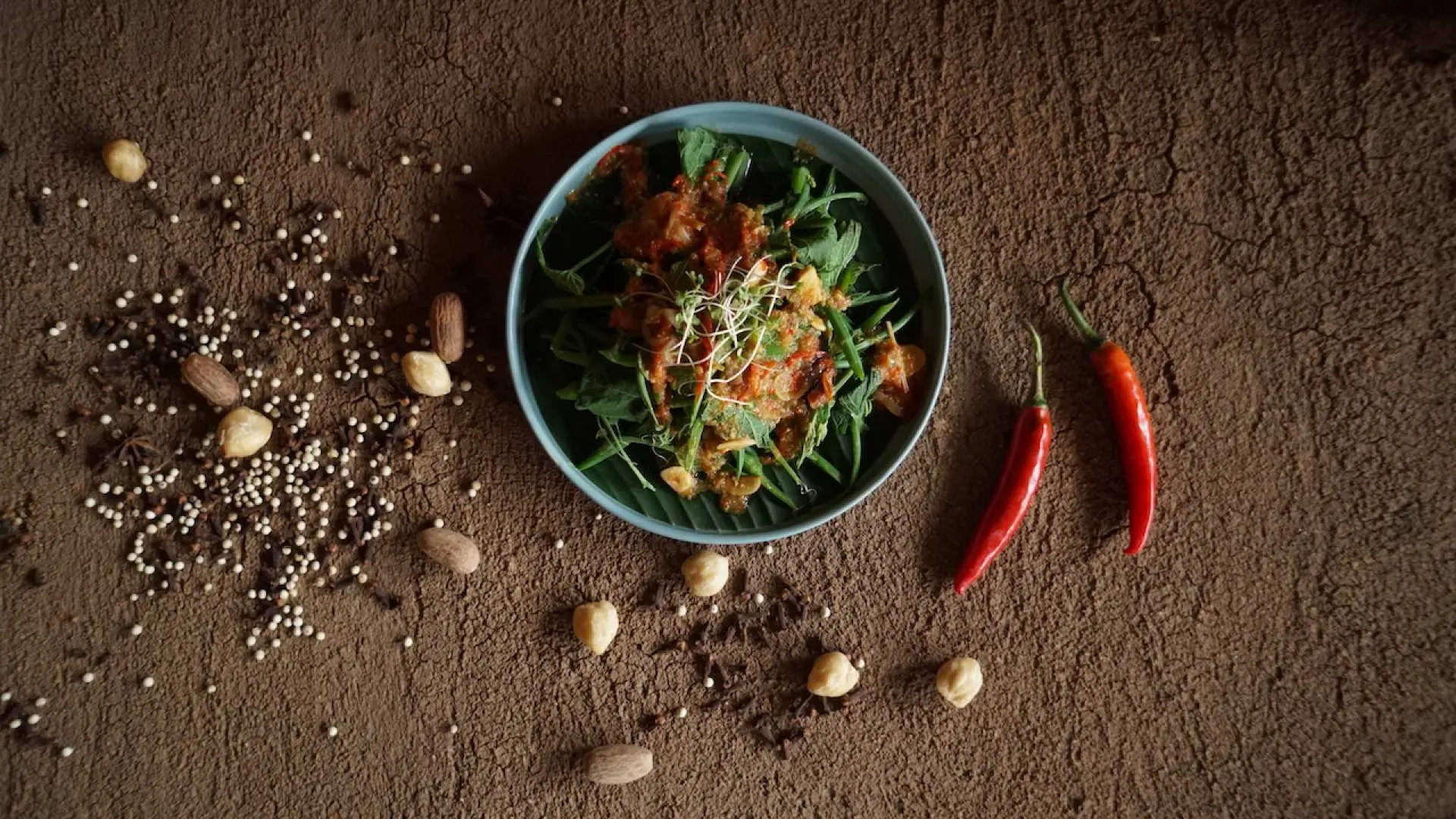 A delectable Balinese dish, featuring fresh local ingredients and rich flavors, served at Tlaga Singha Tropical River Pool Club, promising an authentic culinary experience.