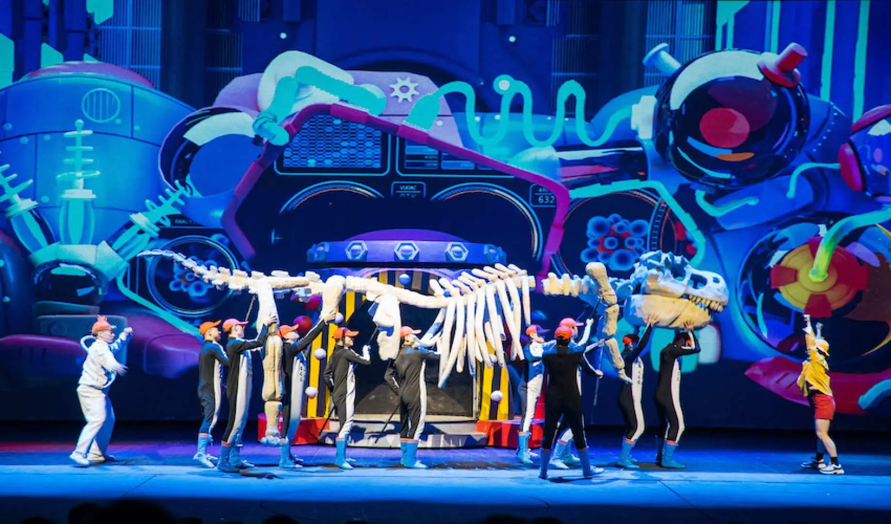 Performers on the Shanghai Songcheng Show stage manipulate a giant dinosaur skeleton, combining a futuristic backdrop and lighting to present a stunning show where technology meets history.