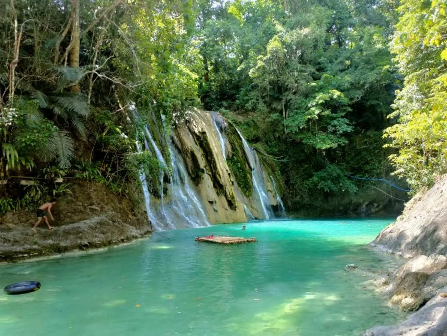 Daranak Falls in Tanay, Rizal, Philippines, featuring clear turquoise water and lush tropical greenery, offering a refreshing swimming and relaxing experience.