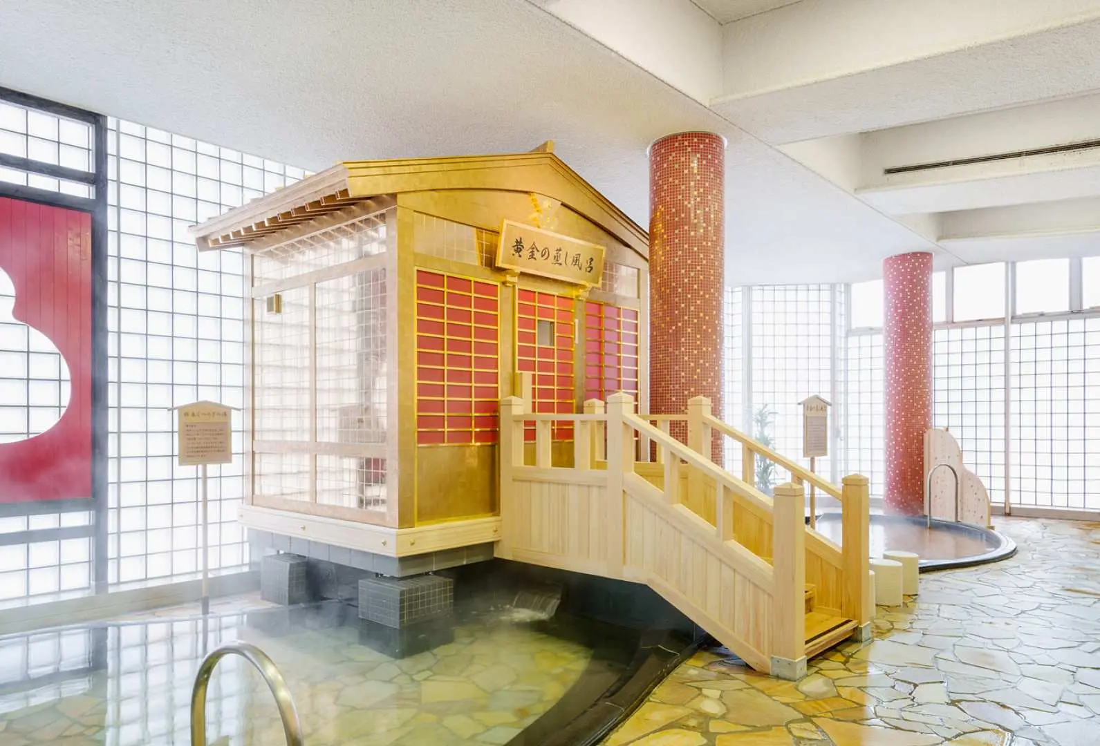 Unique Golden Steam Sauna inside Taikou no Yu, featuring a golden hut design with modern glass brick walls, reflecting the historical exploration theme.