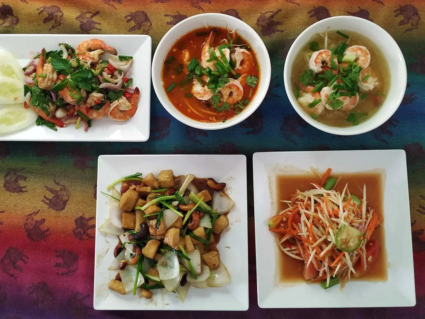 A vibrant spread of authentic Thai dishes and soups, showcasing the delicious culinary achievements from the My Thai Cooking class in Bangkok.