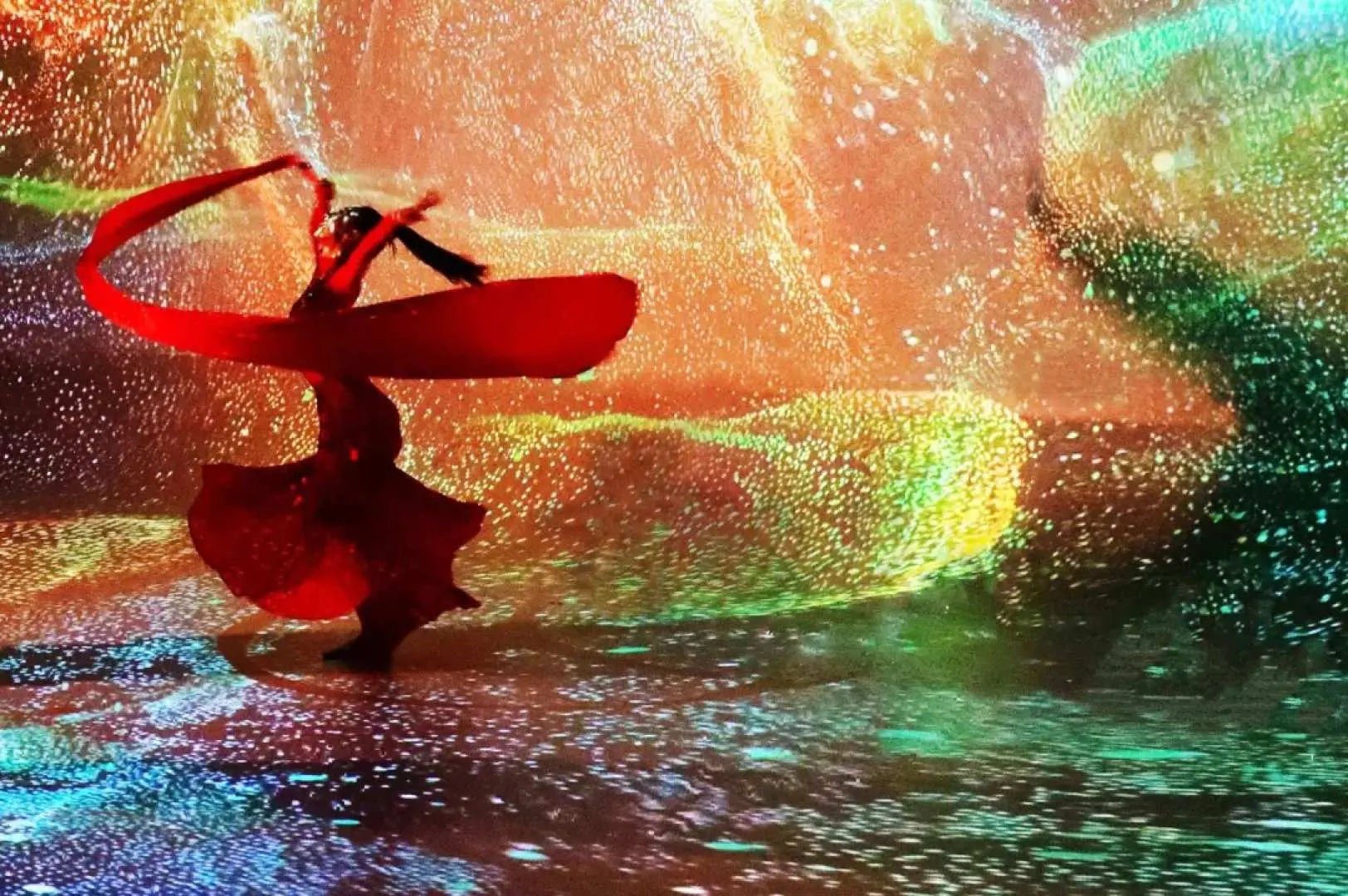 A dancer in a red gown performs amidst a stunning immersive digital light and shadow art projection at Beijing Palace Banquet's gallery, creating a visually spectacular experience.