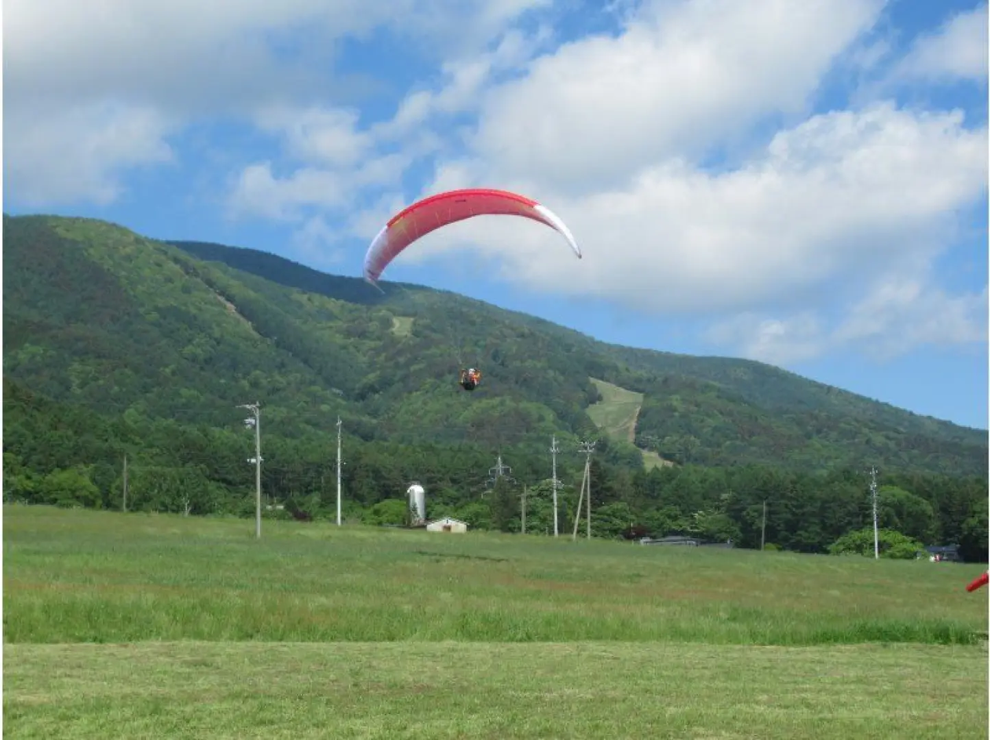 We're heading to the dedicated landing area at the bottom of the ski slope.