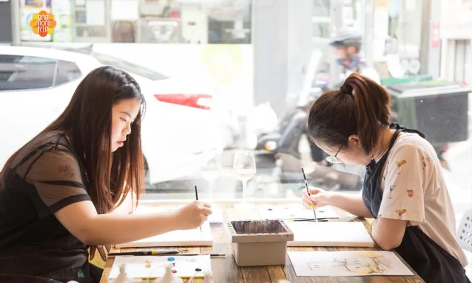 Take a break while painting a picture during a busy city tour.