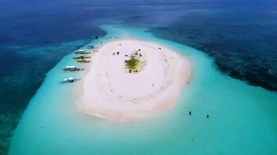 Experience the wonders of nature on the plain white-sand beaches of Naked Island