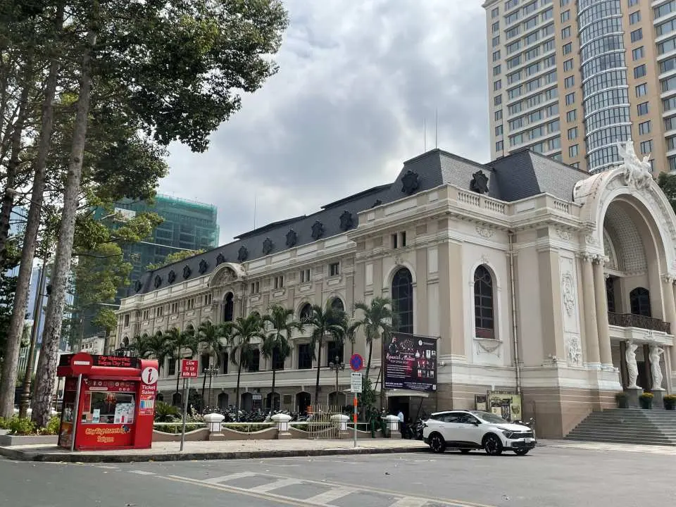The magnificent Saigon Opera House building in Ho Chi Minh City, with its elaborate French neoclassical facade, stands as a prominent landmark in downtown Saigon, perfect for hop-on hop-off sightseeing.