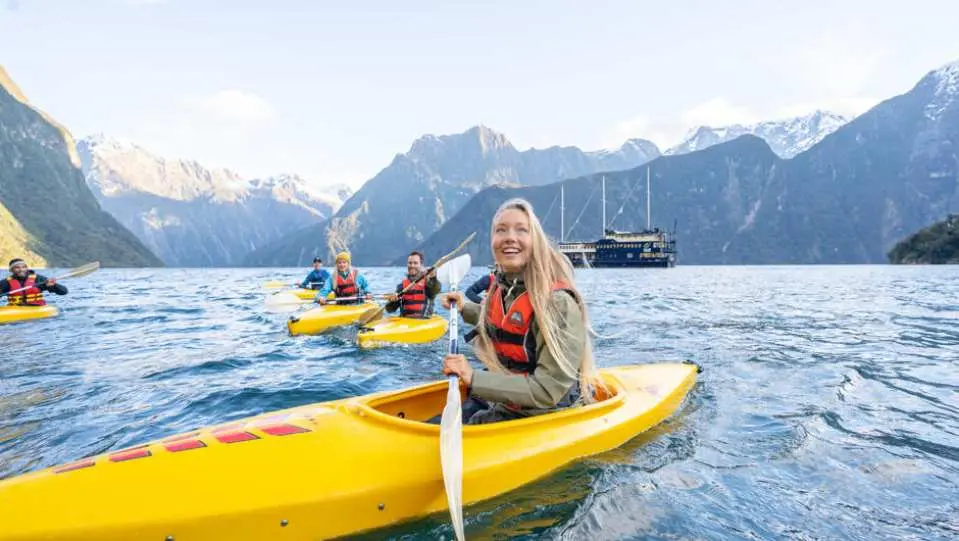 tourists kayaking along the Tasman Sea