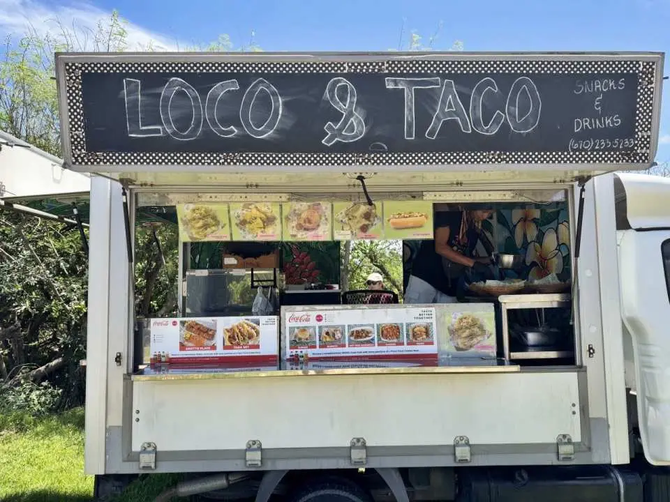 A vibrant 'Loco & Taco' food truck in Saipan, offering convenient and delicious local meals like tacos and hot dogs, perfect for hungry adventurers after Grotto exploration.