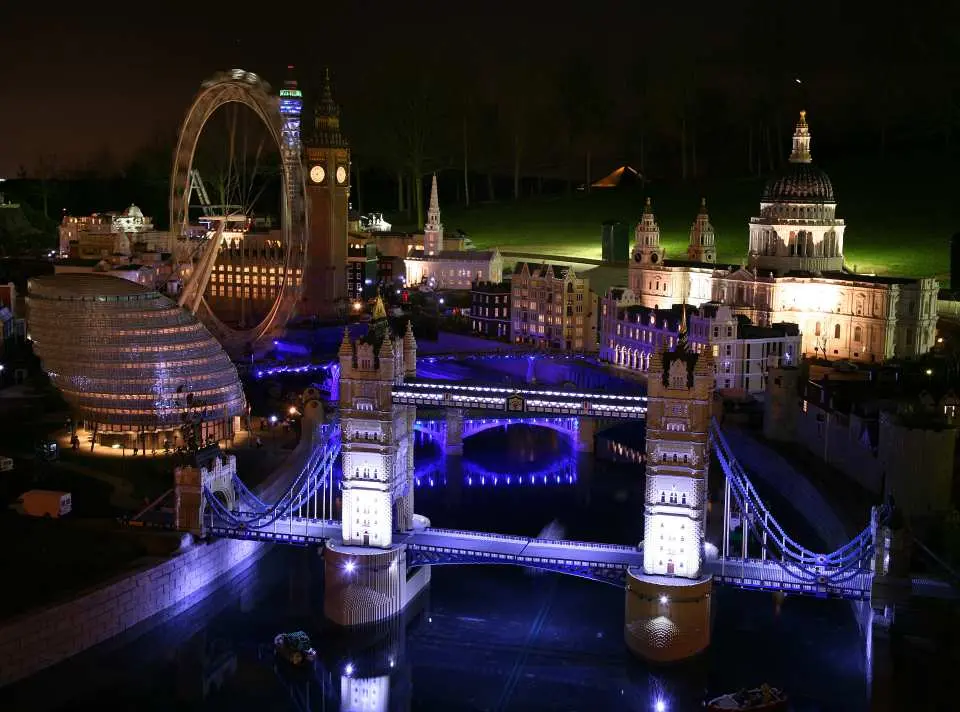 Illuminated LEGO models of London landmarks like Tower Bridge, Big Ben, and the London Eye in Miniland at Legoland Windsor, UK.