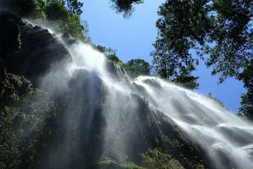 Head to the famous Tumalog Falls and take photos of the picturesque falls