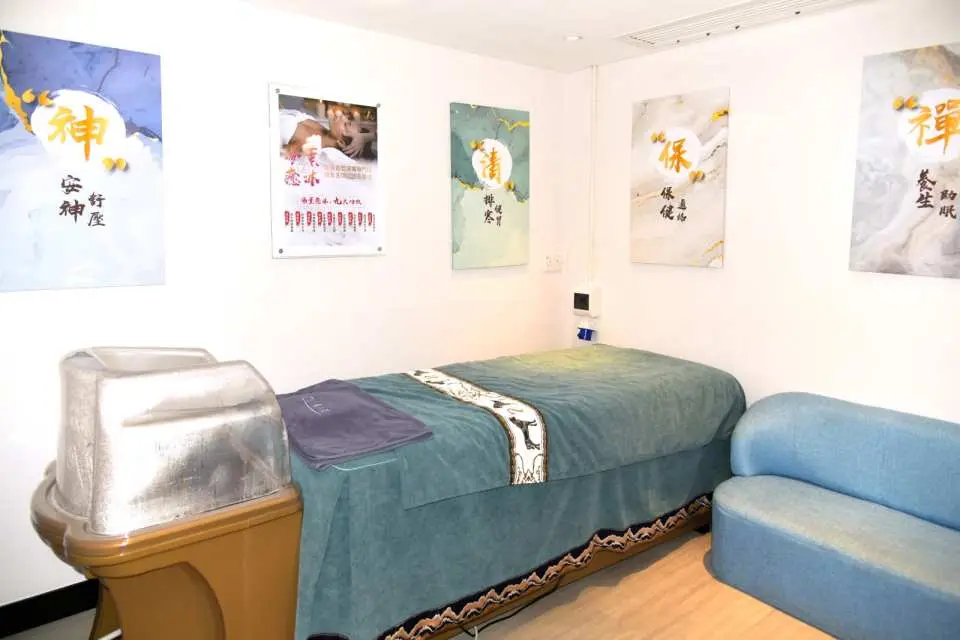 Aqua SPA treatment room designed for Kami-no-Yu fumigation therapy, featuring a comfortable massage bed and specialized equipment for comprehensive wellness and detoxification.