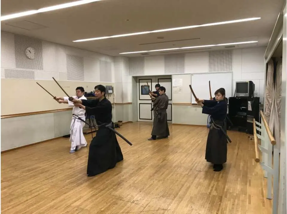 Practice of unsheathing, sheathing, and kata