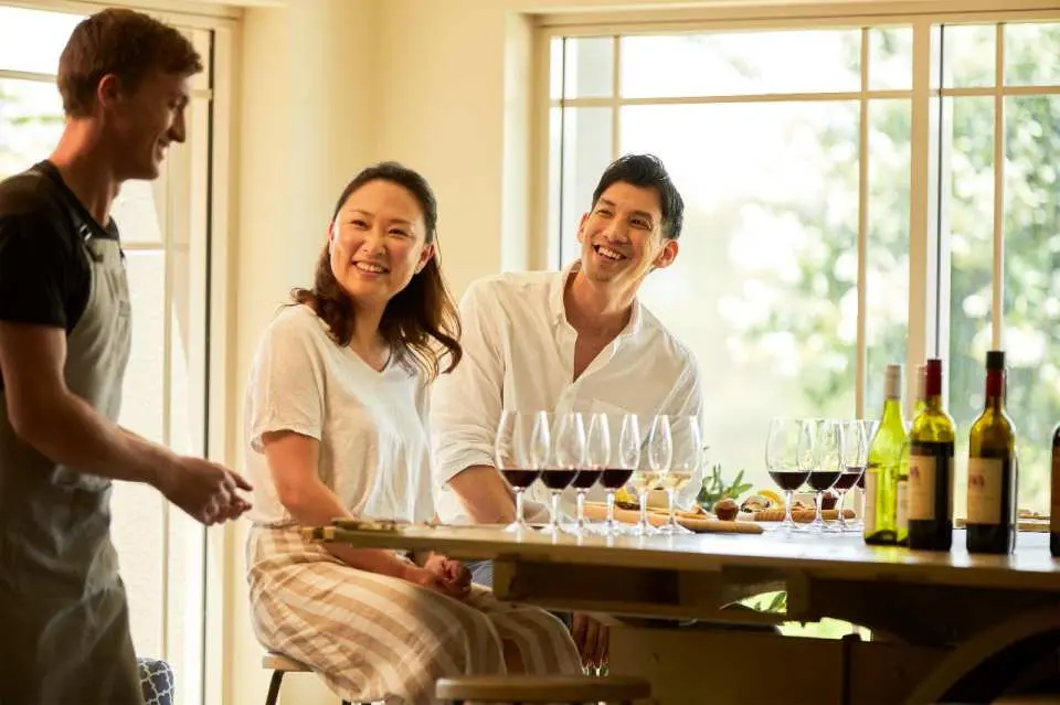 Guests at Tulloch Wines enjoy a private wine tasting experience led by a wine ambassador, featuring Hunter Valley's signature wines paired with local cheeses and charcuterie.