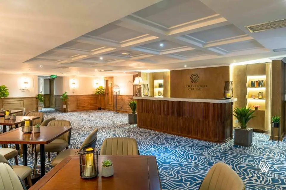 Elegant interior reception area on the Ambassador luxury cruise, featuring modern decor and comfortable seating, offering a welcoming and sophisticated ambiance.
