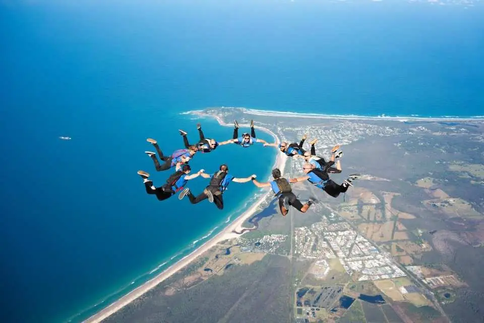 Glide through the clear blue skies as you free-fall at a speed of 200 km/h!