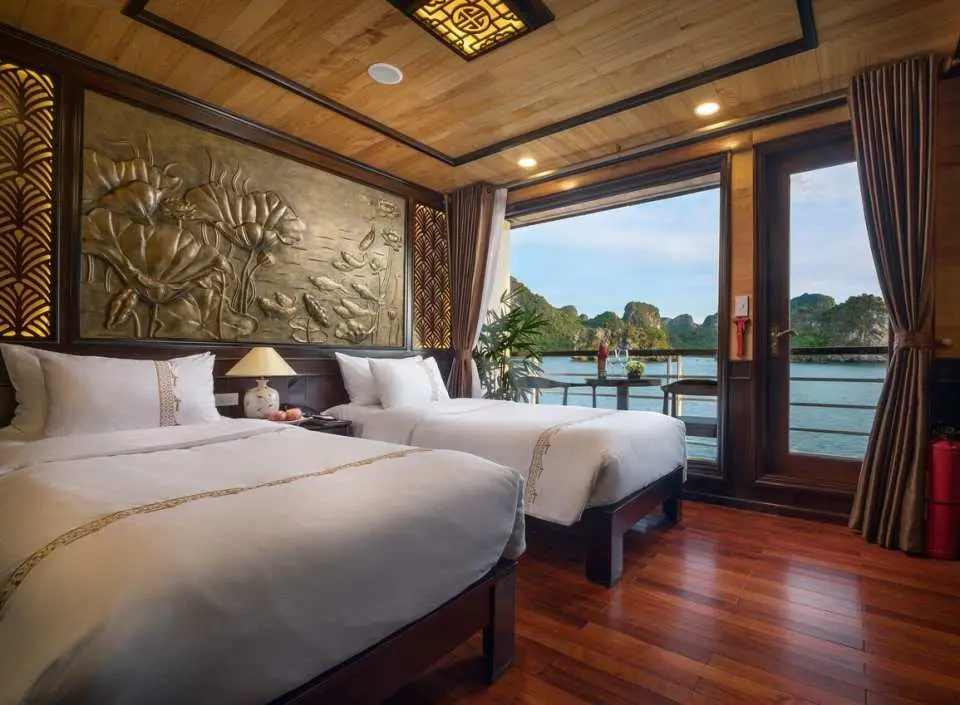 The comfortable sea-view twin cabin on the V'Spirit cruise offers charming views of Lan Ha Bay, providing quality accommodation for a 2-day 1-night or 3-day 2-night Halong Bay adventure.