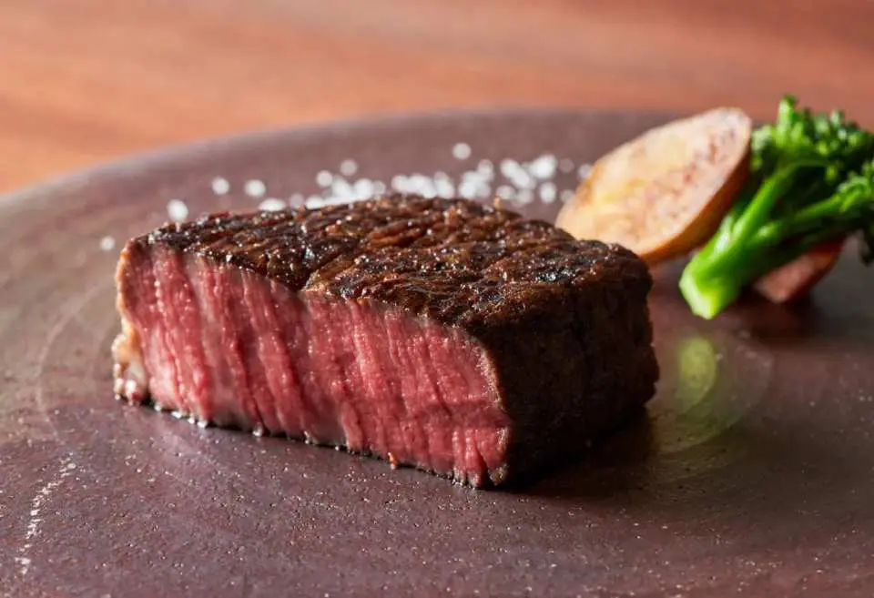 Feature wood-fired cooking, offering a fusion of French and Japanese cuisines, with highlights like Wagyu steak and Basque cheesecake