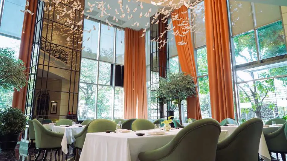 Admire the stylish decor and chic ambiance at Khao at Wireless Road, offering a sophisticated yet relaxed setting for dining