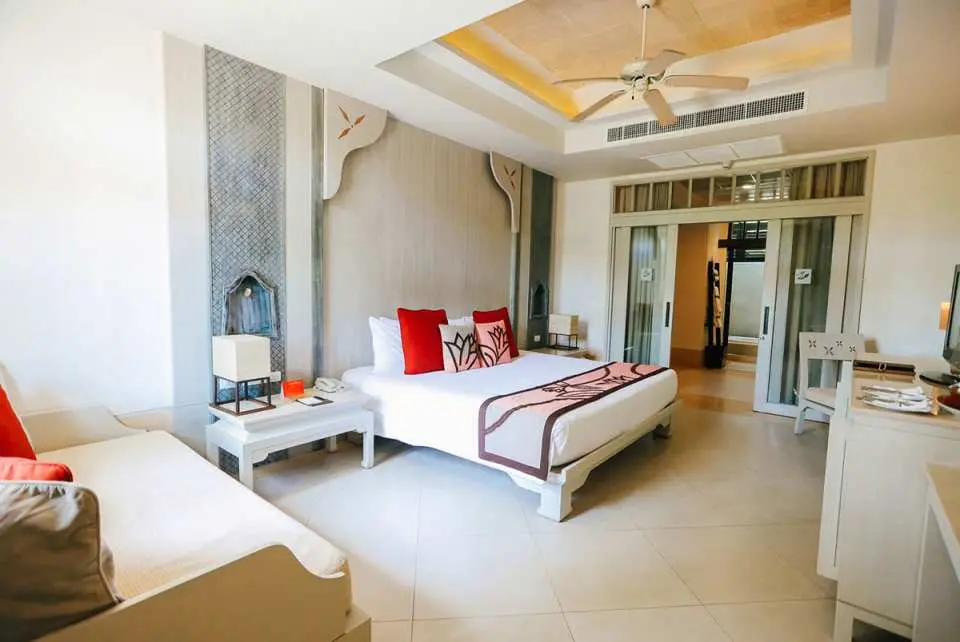 Experience the Grand Deluxe Room, featuring spacious and elegant accommodations with twin or king beds, LCD TV, DVD player, and luxurious amenities. Enjoy a unique two-story design, garden access, clean bathrooms, and beautiful views from private balconies