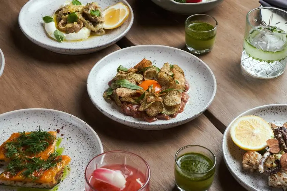 Treat yourself to a vibrant atmosphere with low sofas, soulful tunes, and a menu brimming with creative cocktails and Mediterranean-inspired plates