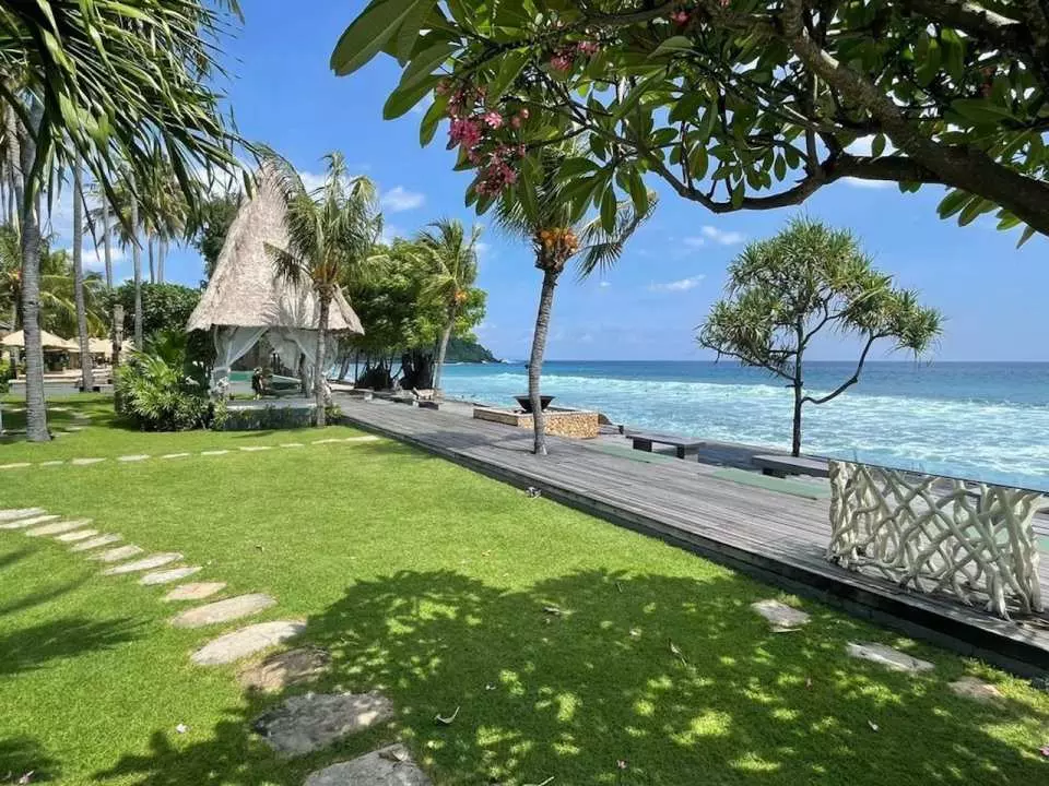 Experience breathtaking ocean vistas from the comfort of your room at Qunci Villas, perfect for relaxation and enjoying stunning sunsets