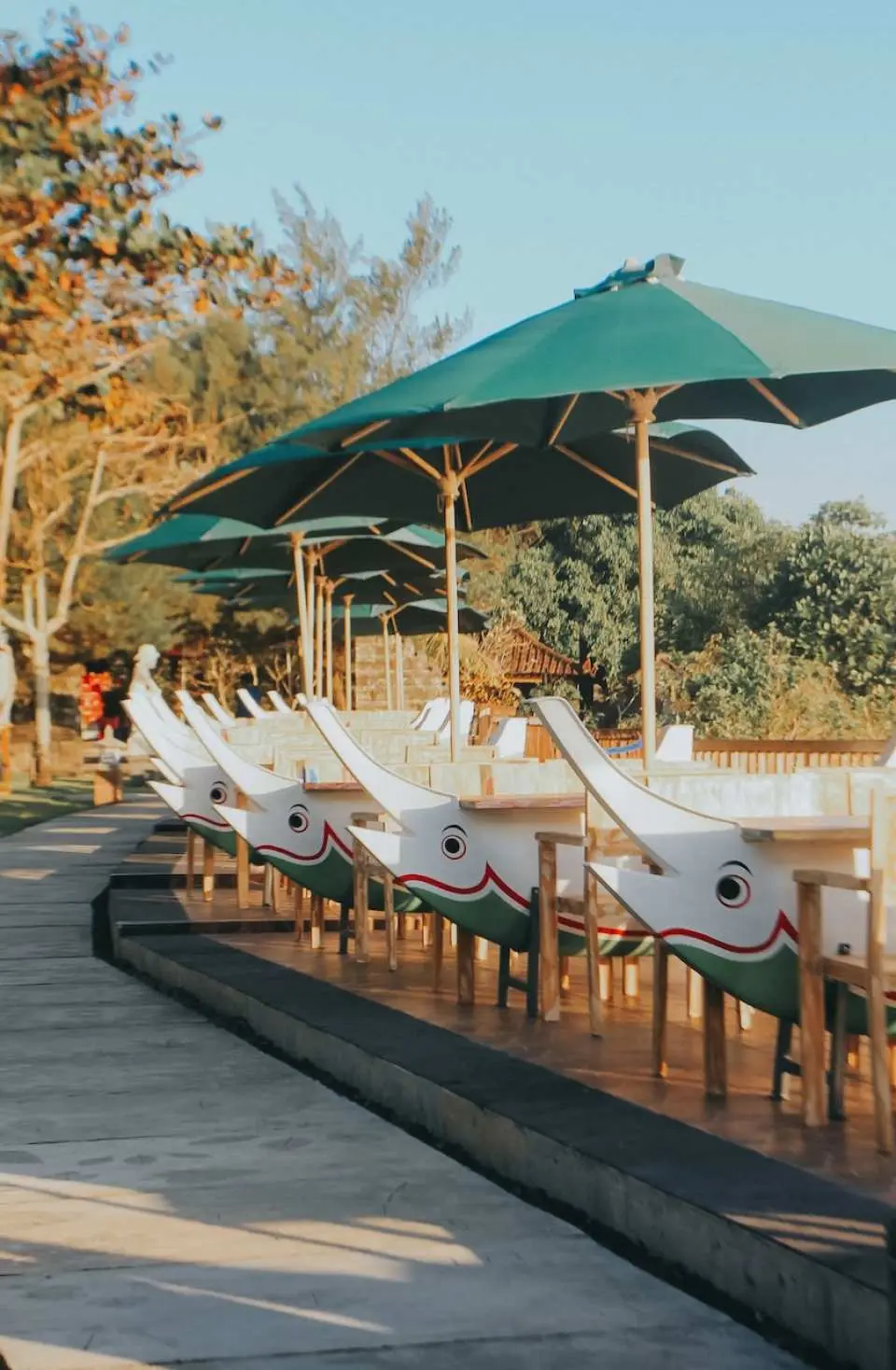 Dine at the exclusive Jukung Table in the De Jukung Resto's Surya Mandala area, right at Tanah Lot.