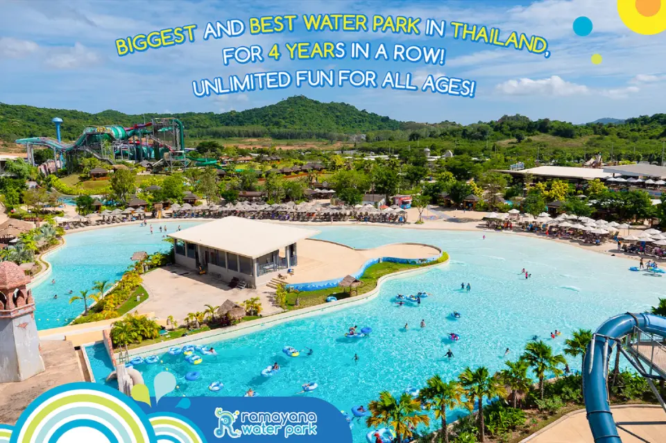A expansive panoramic view of Ramayana Water Park in Pattaya, featuring a joyous crowd in the wave pool, surrounded by various slides and tropical vegetation, showcasing the endless charm of Thailand's largest water park.