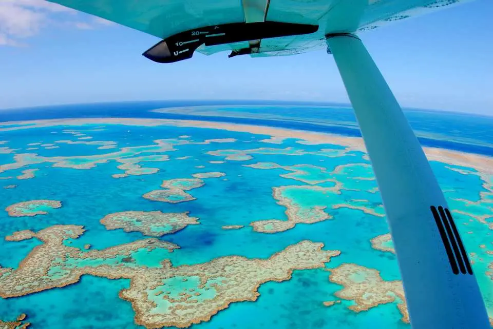 Overlook the picturesque Hill Inlet and Whitehaven Beach from the mini plane