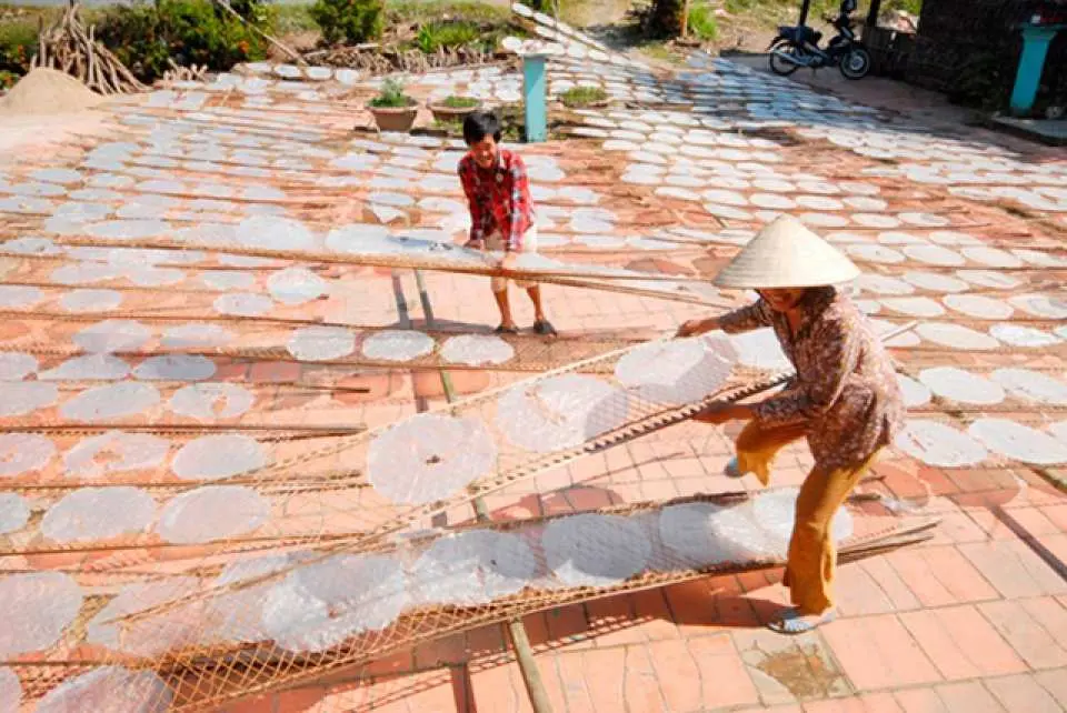 Visit a family-run business producing rice paper, learn how it is produced.