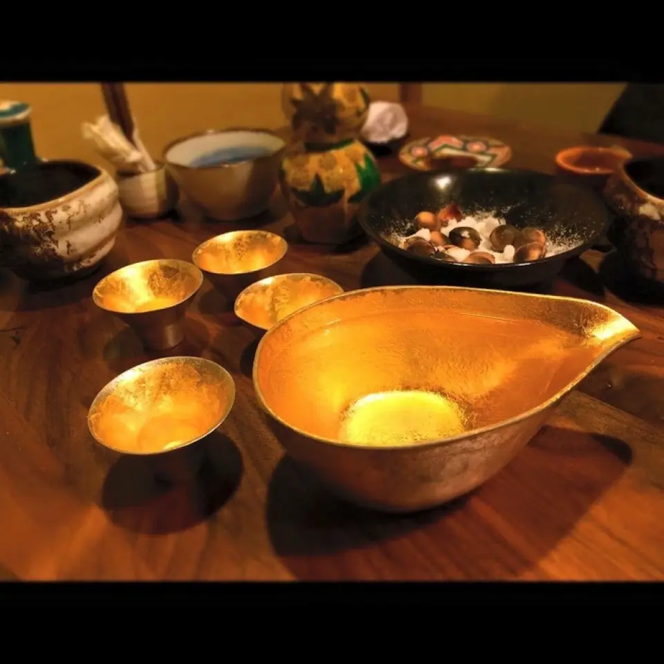 Tin is perfect for sake vessels! It reacts with the alcohol and makes it milder!