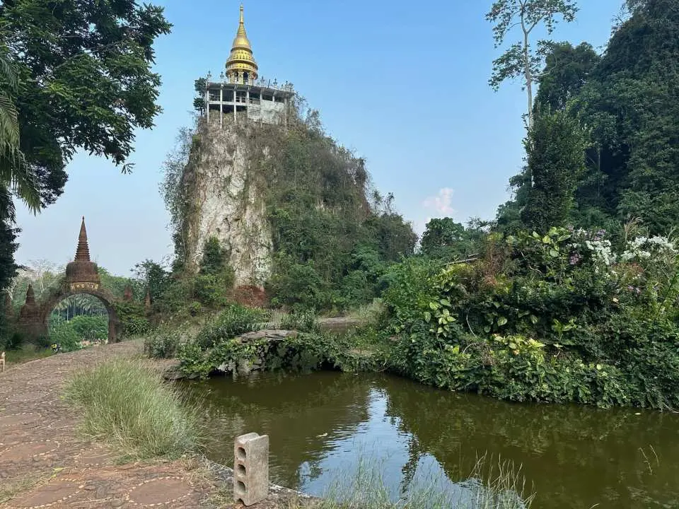 Step through the gateway to wonder – the Entry to the Enchanted Hanging Temple, where ancient beauty meets tranquil nature