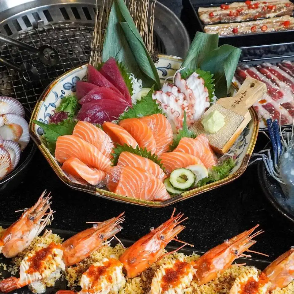 Experience the ultimate Yakiniku buffet with melt-in-your-mouth marbled beef and unlimited salmon sashimi