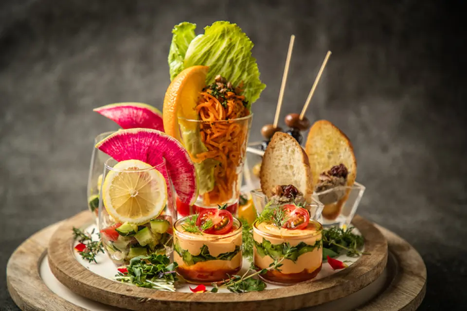 These "verrine" style appetizers, served in small glass cups, possess the vibrant colors, delicate presentation, and playful spirit of a sweet treat. Their beauty evokes the same excitement as opening a jewelry box. Enjoy this indulgent appetizer as you begin your meal at Glass Dance.